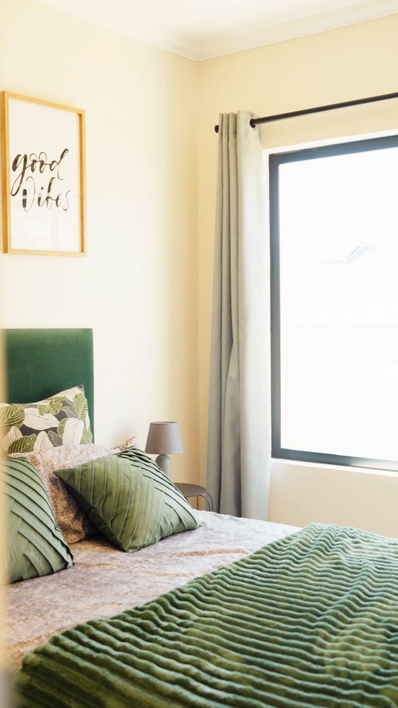 Bedroom of an Okamita Properties show house, daylight through the window